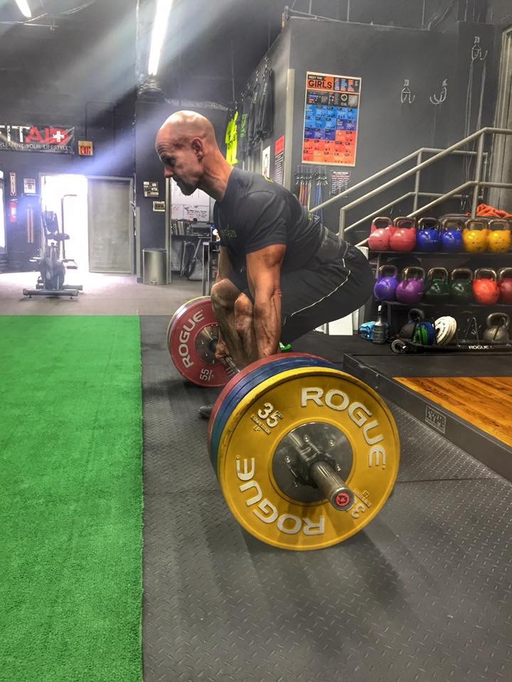 Graham Harding performing a deadlift in the gym